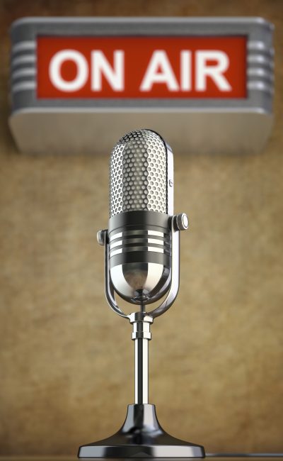 Retro microphone in the old studio with on air sign
